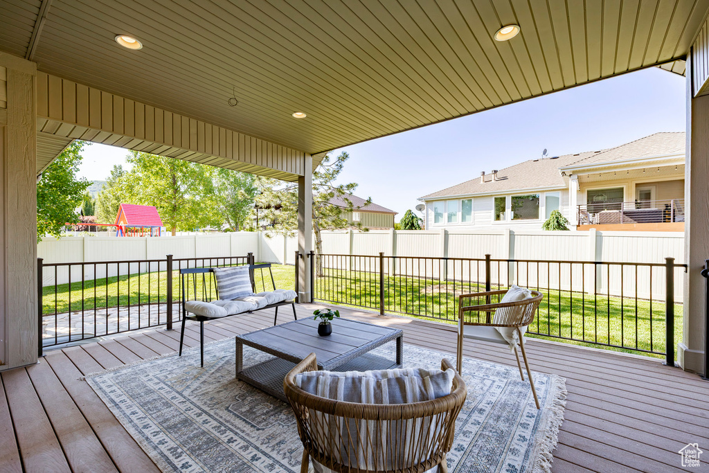 Wooden deck with an outdoor living space