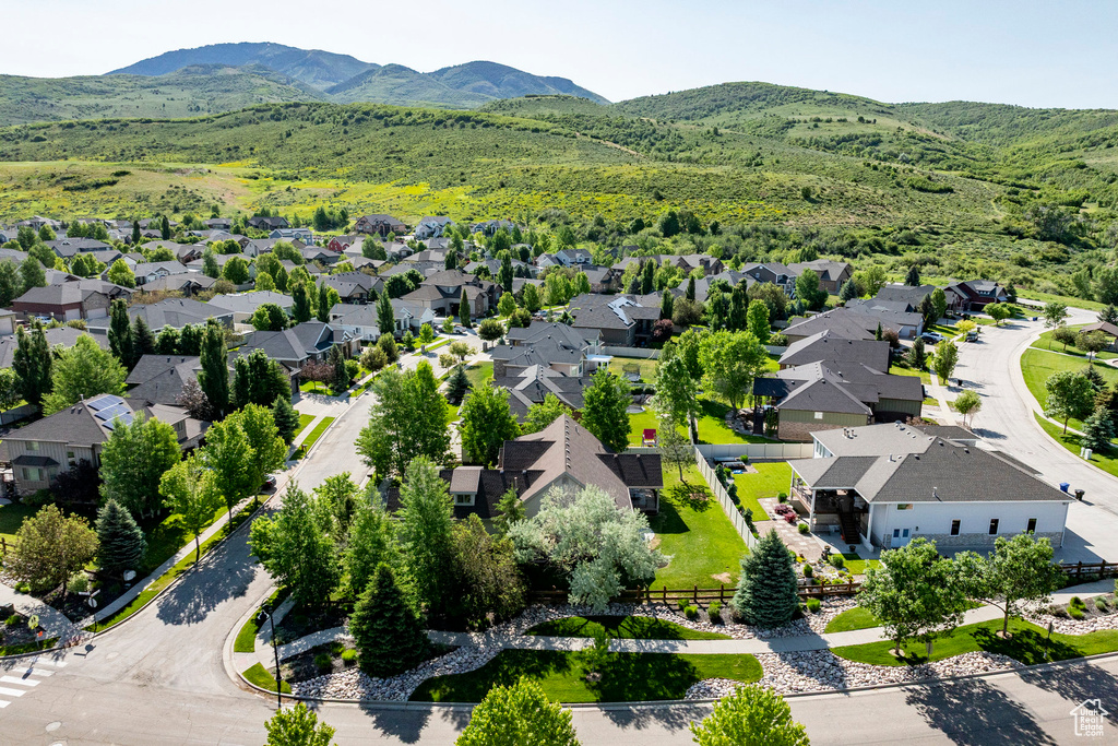 Aerial perspective of suburban area featuring a mountain backdrop
