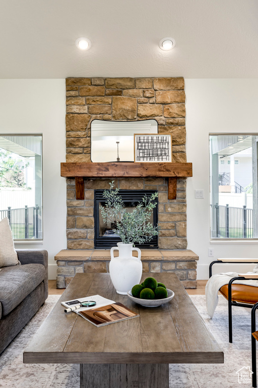 Living room with a fireplace and wood finished floors