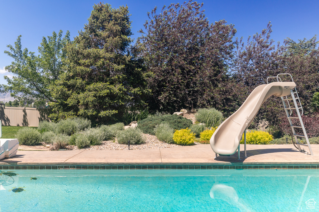 Swimming pool featuring a water slide