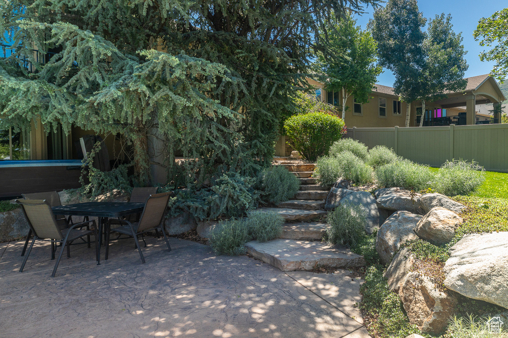 View of patio / terrace featuring outdoor dining area and stairway