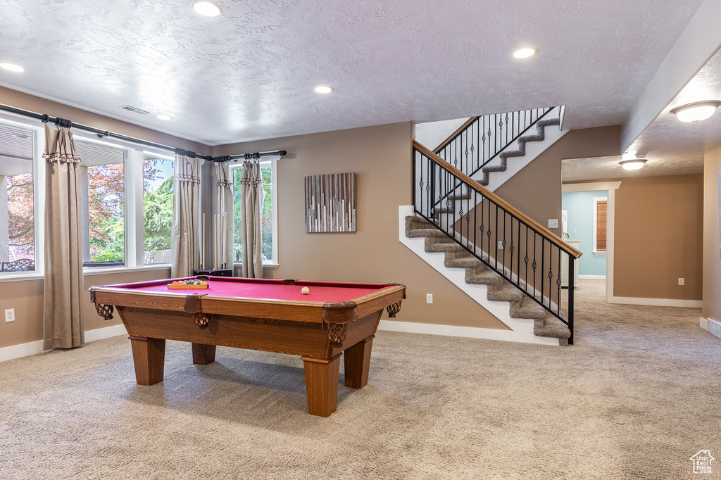 Recreation room featuring baseboards, carpet flooring, pool table, recessed lighting, and a textured ceiling