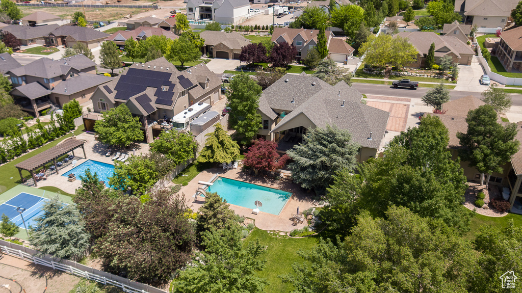 Aerial perspective of suburban area featuring a pool area