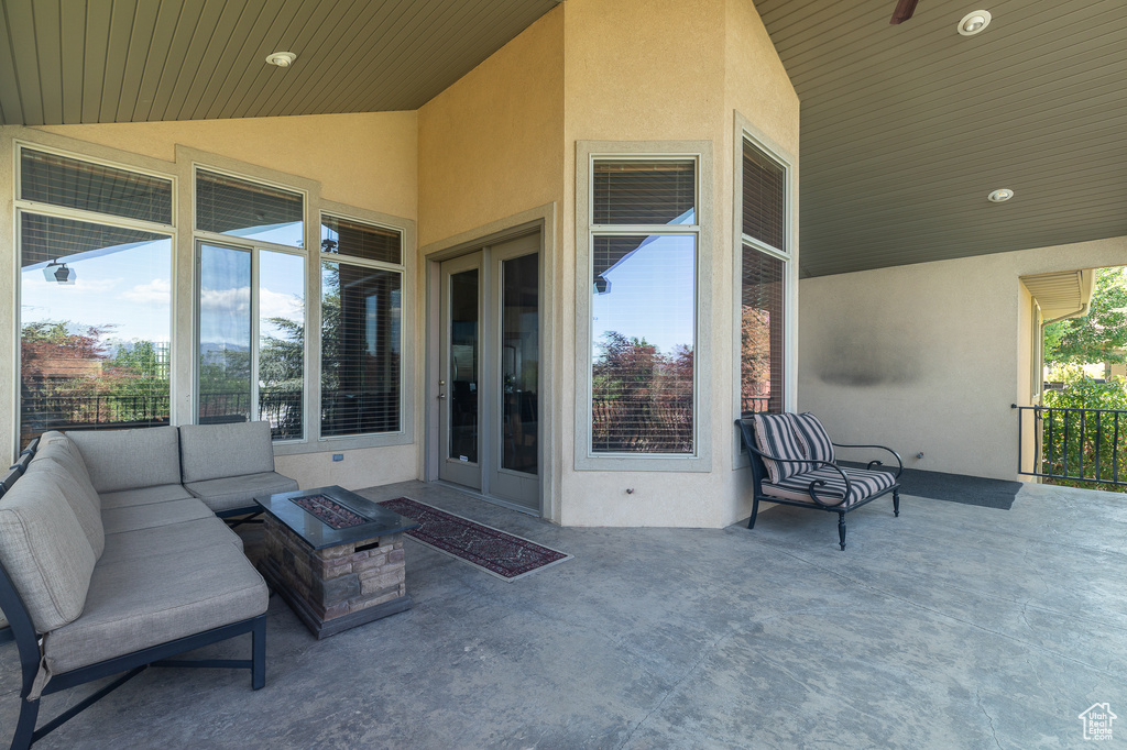 View of patio / terrace with an outdoor living space with a fire pit