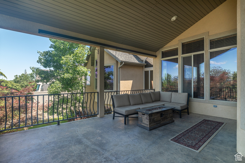 View of patio / terrace featuring an outdoor living space with a fire pit