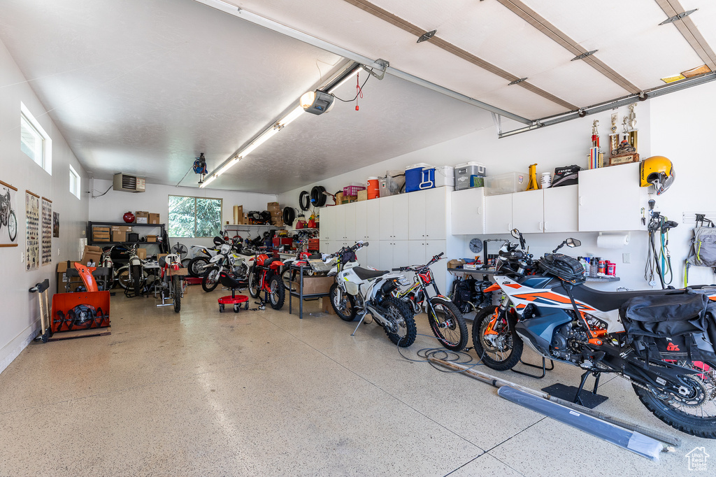 Garage featuring a garage door opener