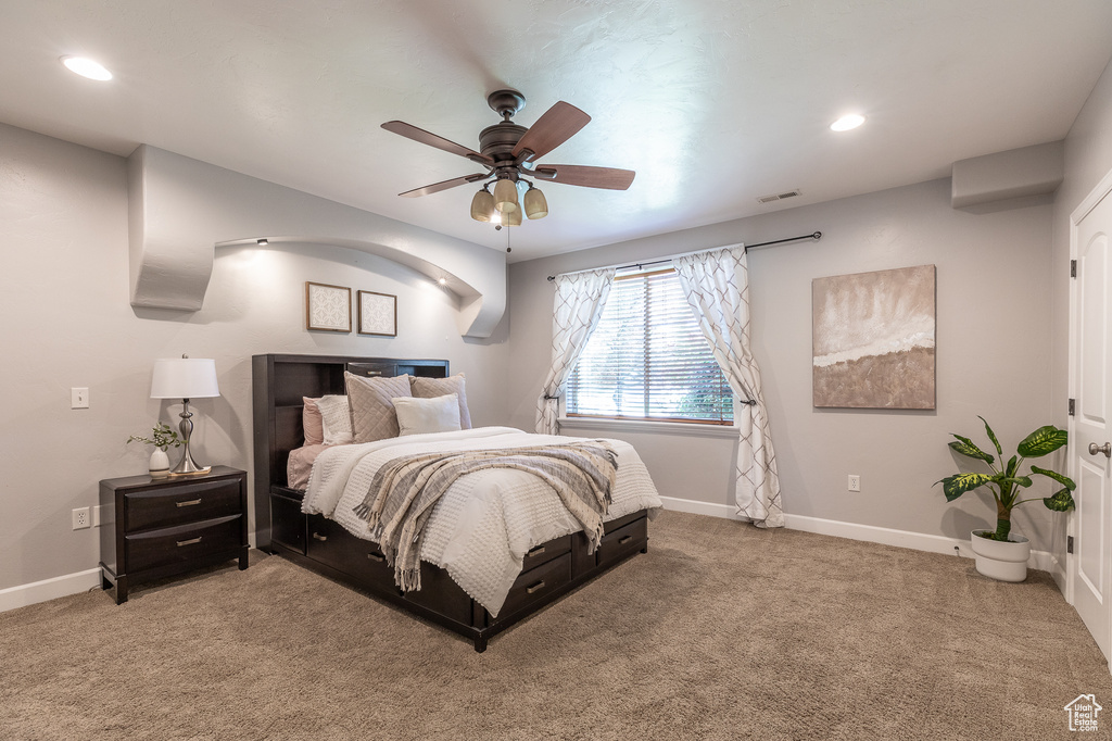 Bedroom featuring light carpet, baseboards, recessed lighting, and ceiling fan