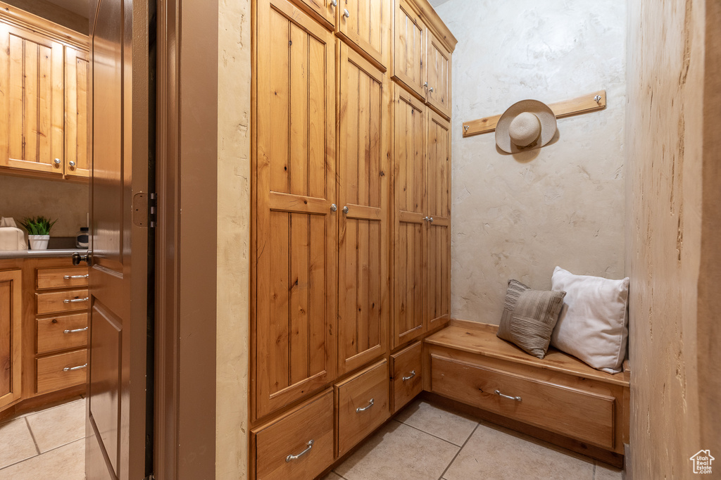 Mudroom featuring light tile patterned floors