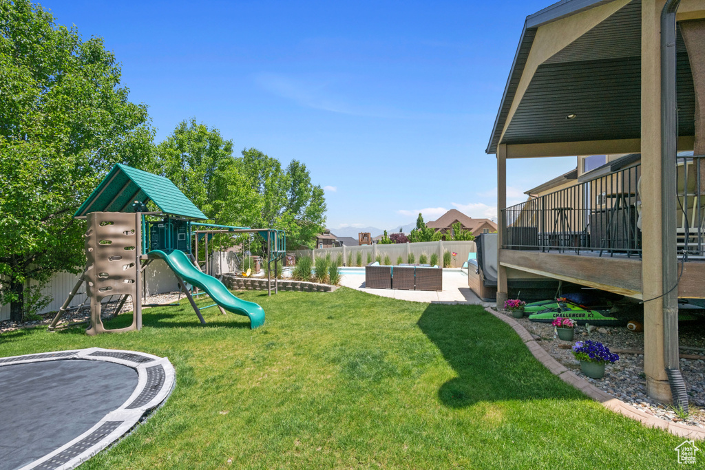 View of yard featuring a playground