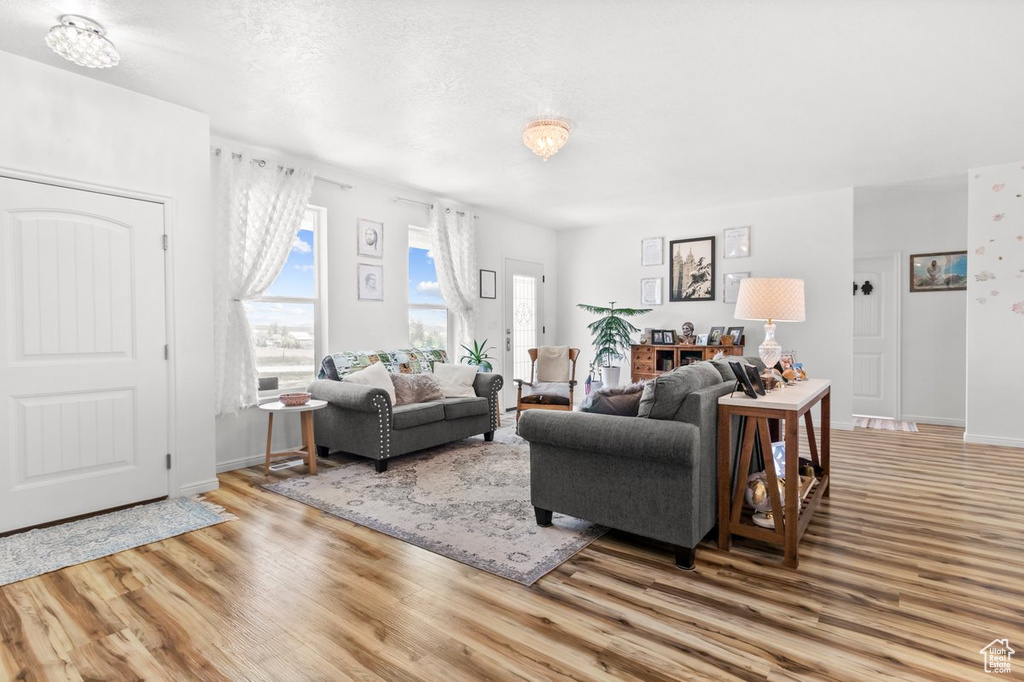 Living room featuring wood finished floors and baseboards