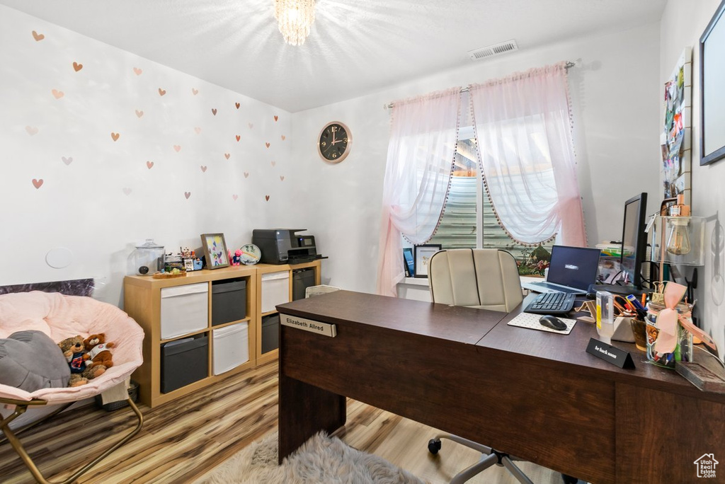 Home office featuring wood finished floors