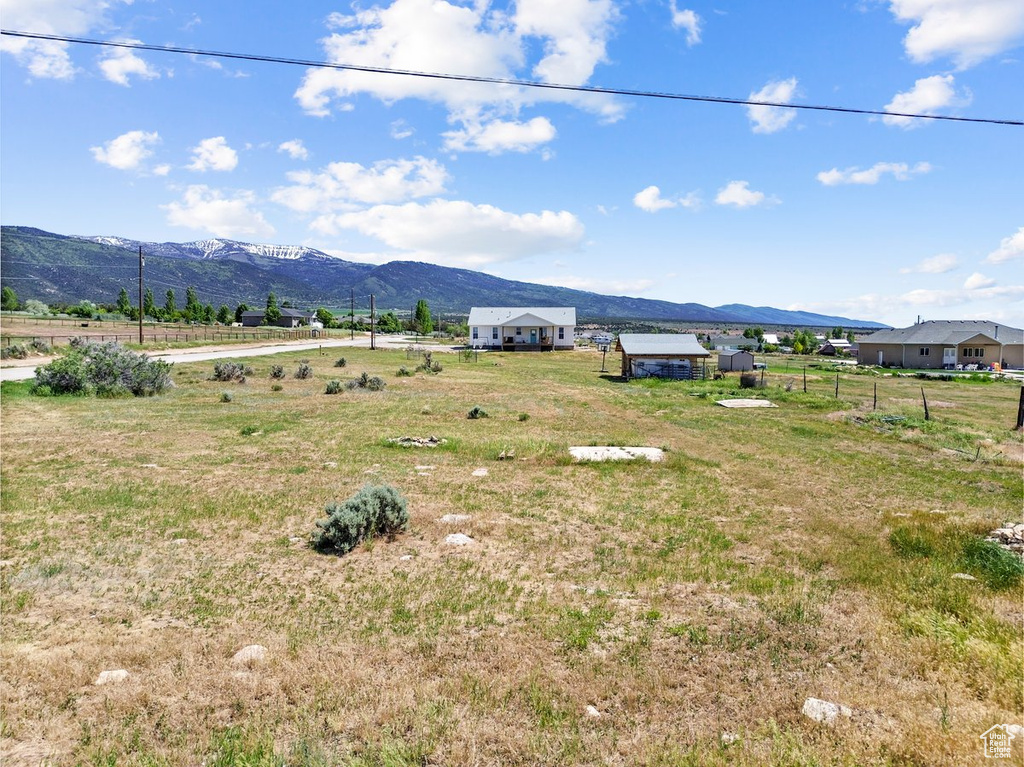 View of mountain background featuring rural landscape
