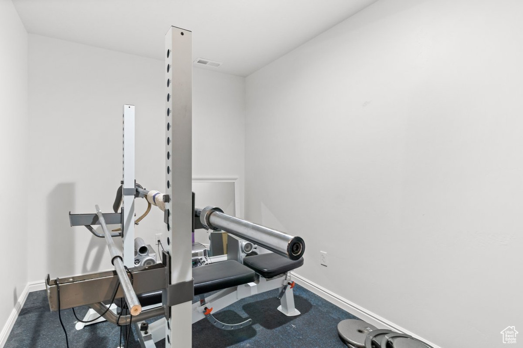 Workout area featuring baseboards