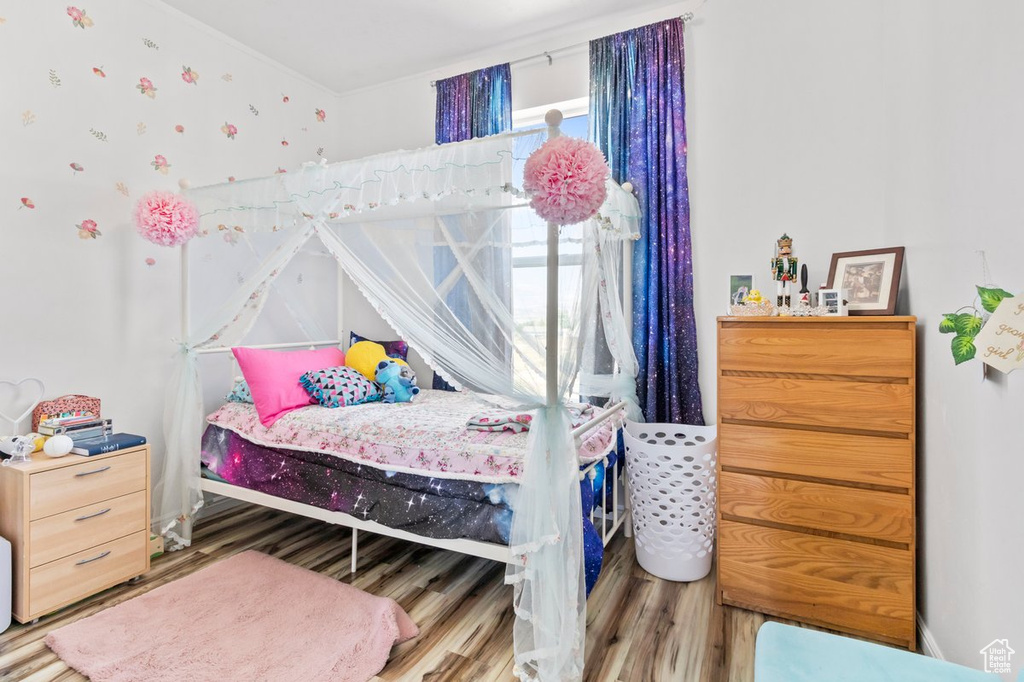 Bedroom with wood finished floors
