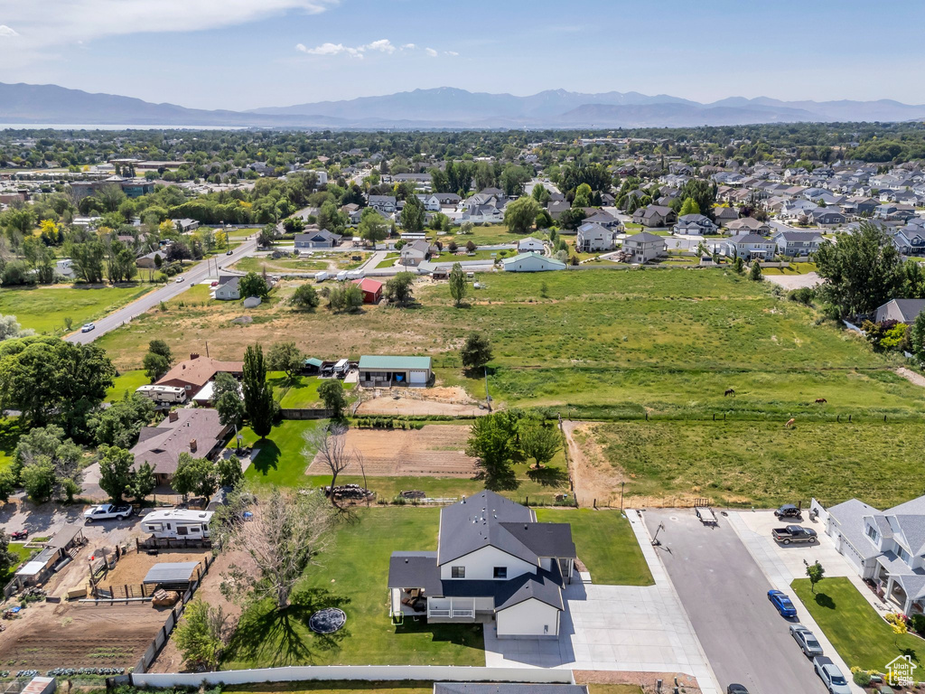 View of property location with mountains and nearby suburban area