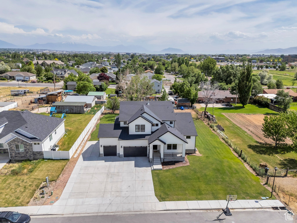 Aerial view of residential area featuring a mountain backdrop