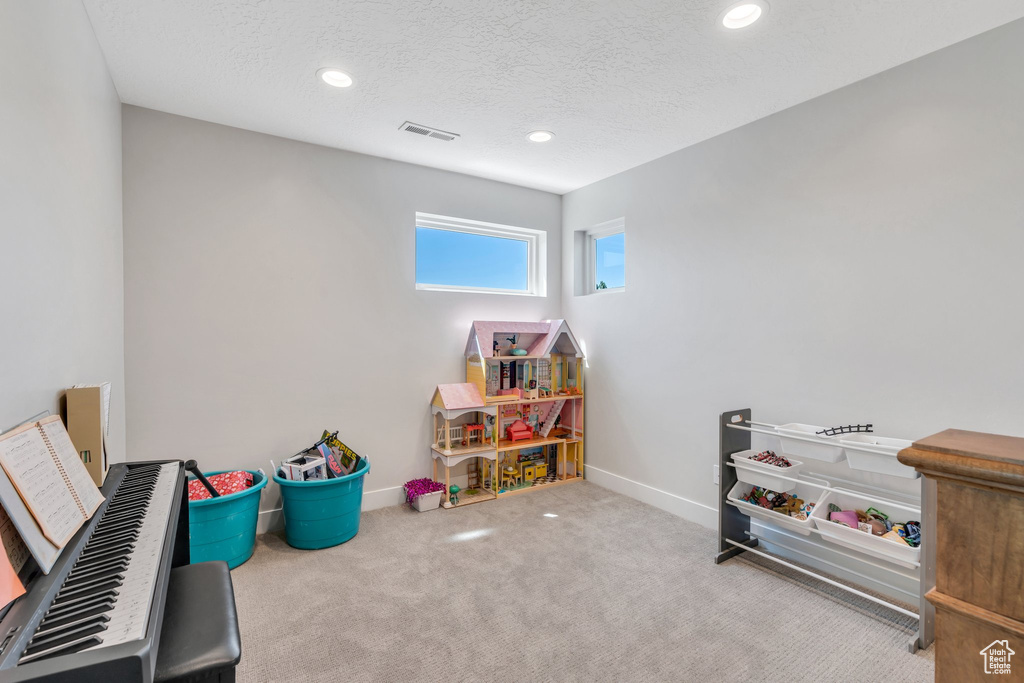 Playroom with carpet flooring, recessed lighting, baseboards, and a textured ceiling