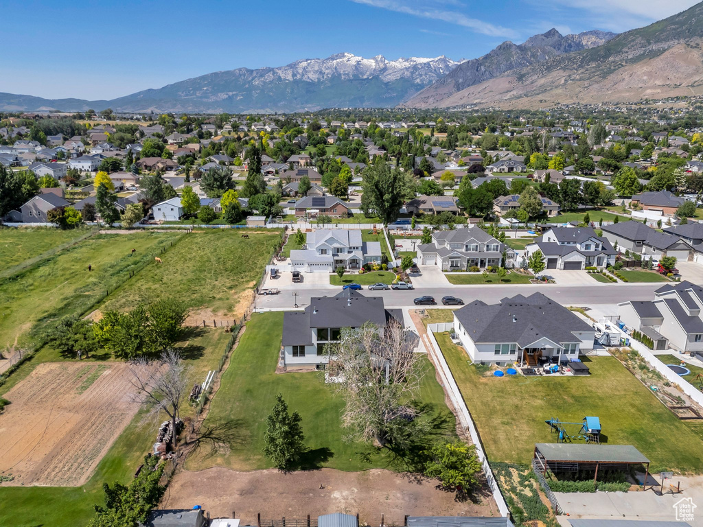 View of property location with a mountain backdrop and nearby suburban area