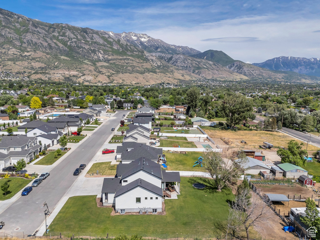 Aerial overview of property\'s location featuring mountains and nearby suburban area