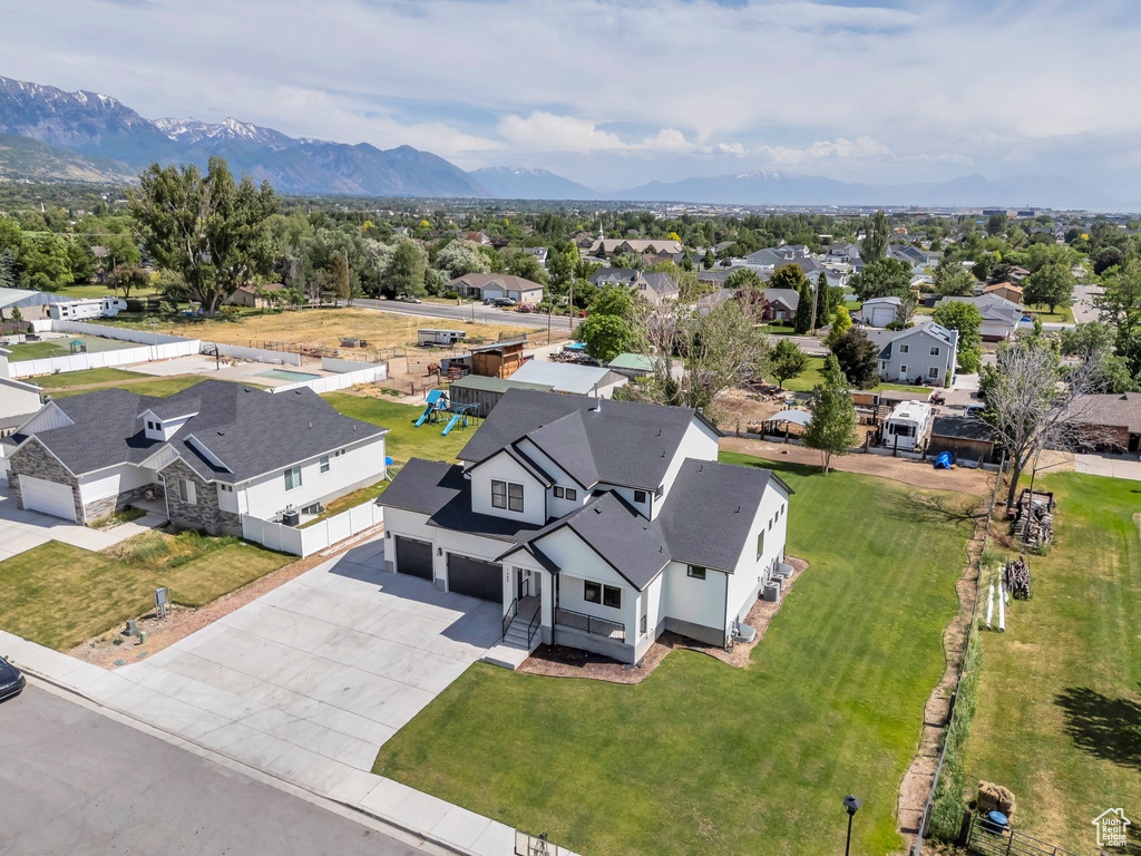 Aerial perspective of suburban area with a mountainous background