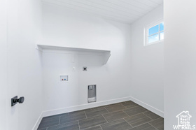 Washroom featuring washer hookup, baseboards, and electric dryer hookup