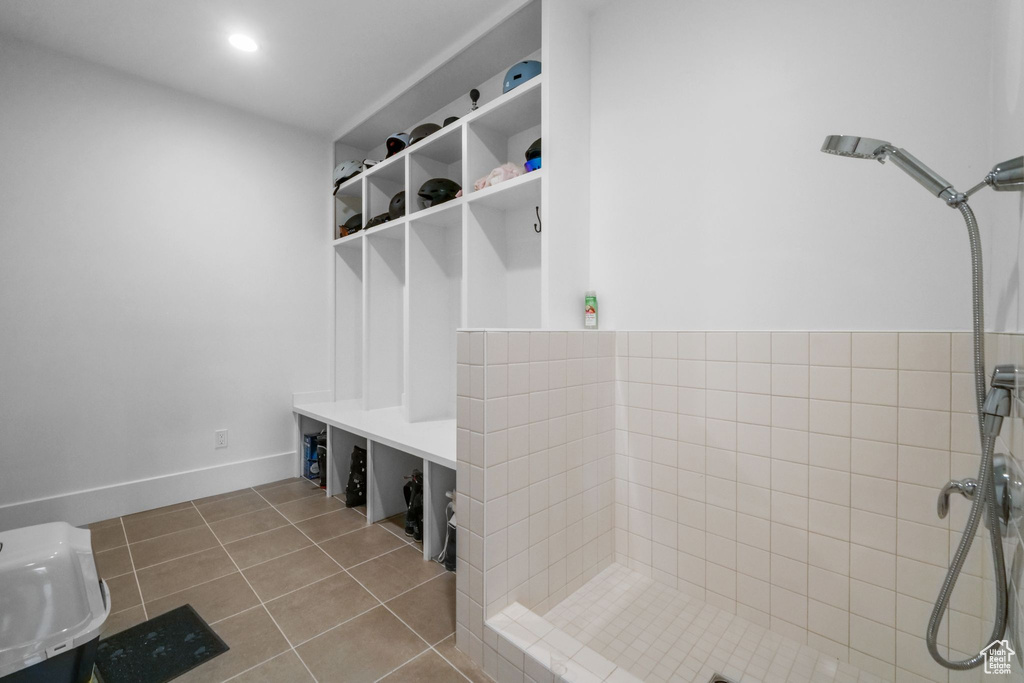 Mudroom featuring tile patterned flooring and baseboards