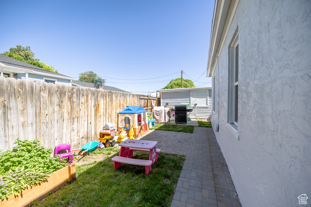 View of yard with a patio