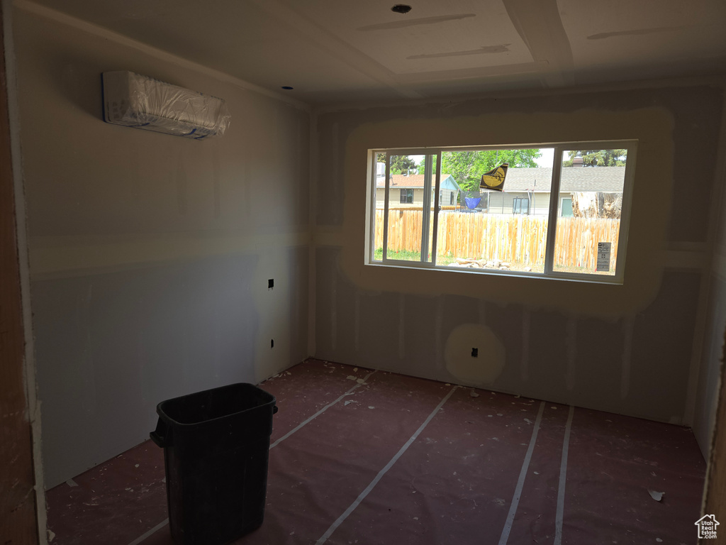 Spare room featuring a wall mounted AC