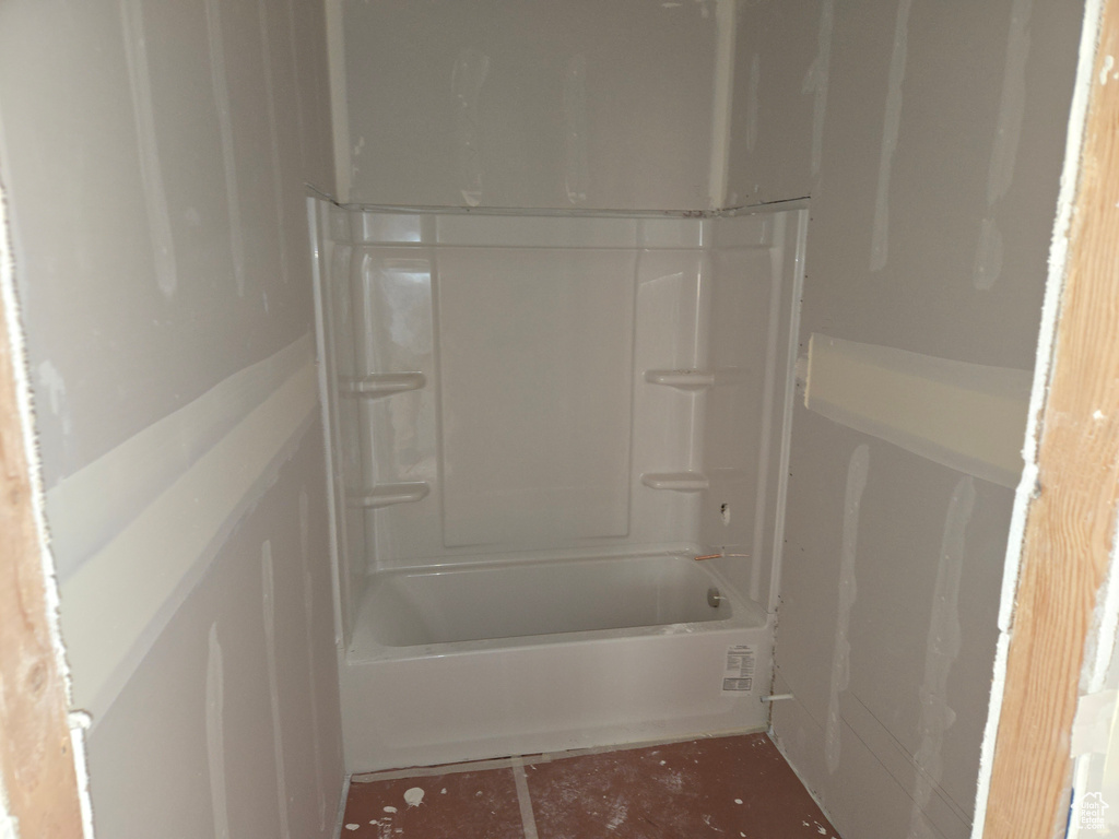 Bathroom with shower / washtub combination