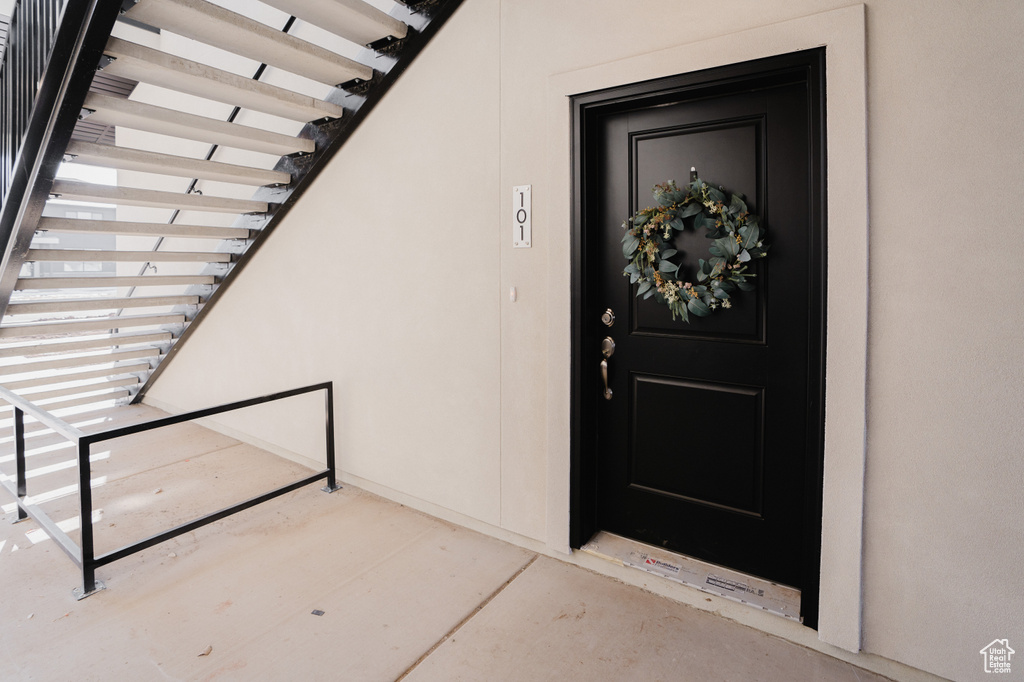 Property entrance with stucco siding