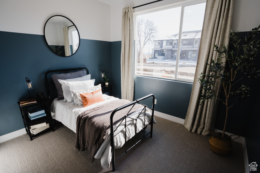 Carpeted bedroom with baseboards