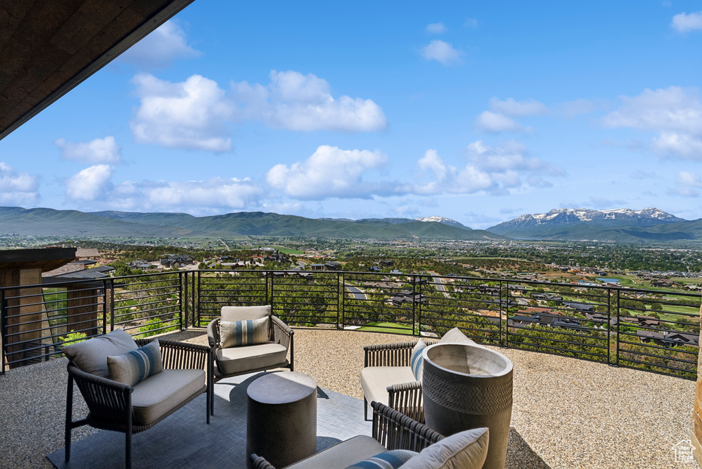 View of patio / terrace featuring a mountain view and a balcony