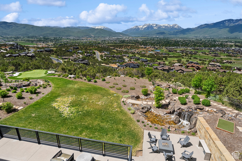 Aerial perspective of suburban area featuring a mountainous background