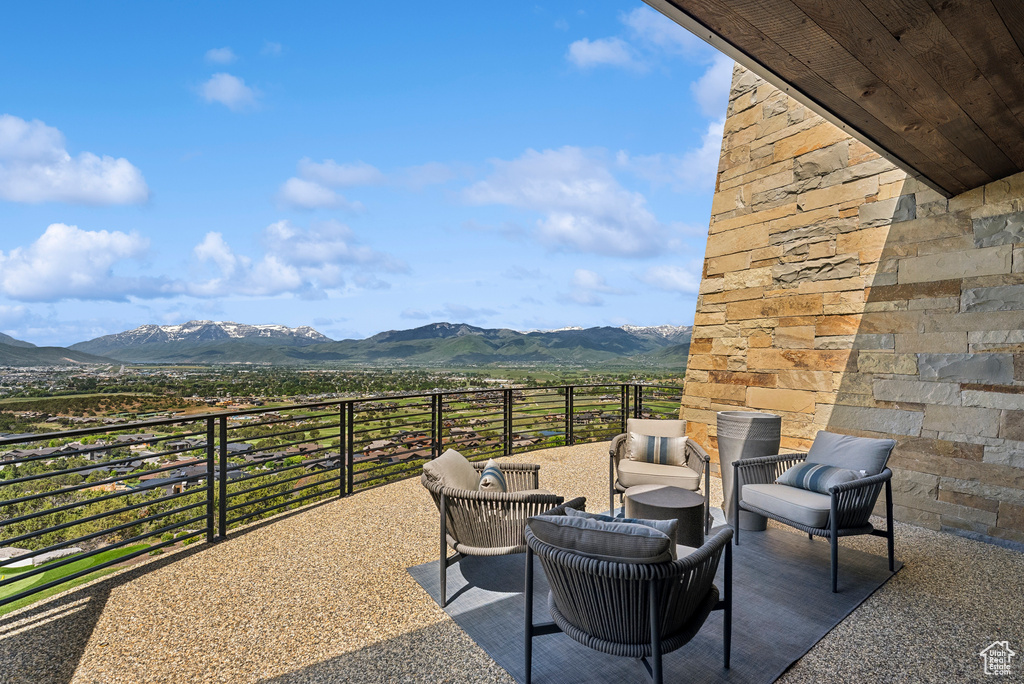 View of patio with a mountain view and outdoor lounge area