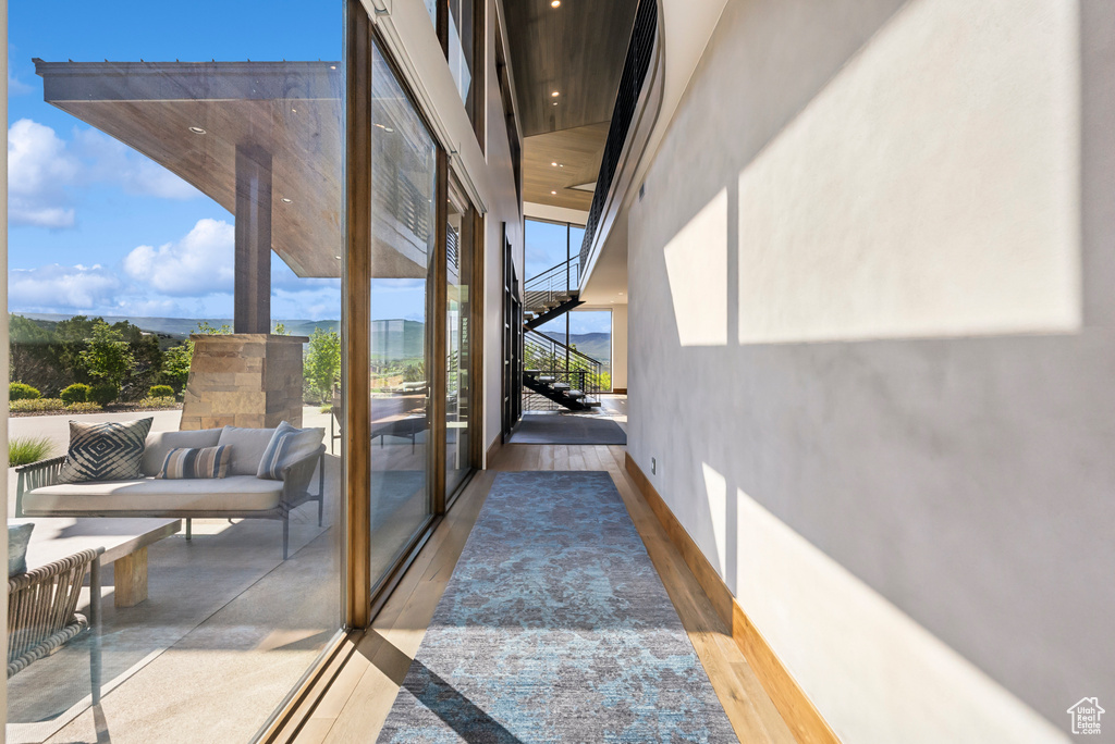 Doorway featuring recessed lighting and wood finished floors