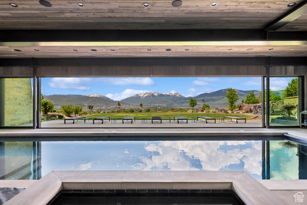 View of pool with a mountain view