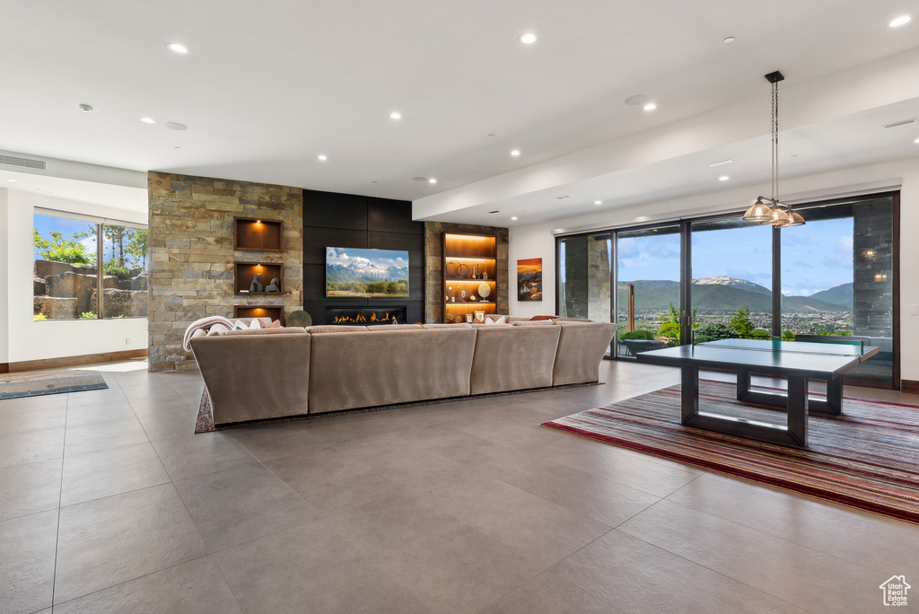Living area with a fireplace and recessed lighting