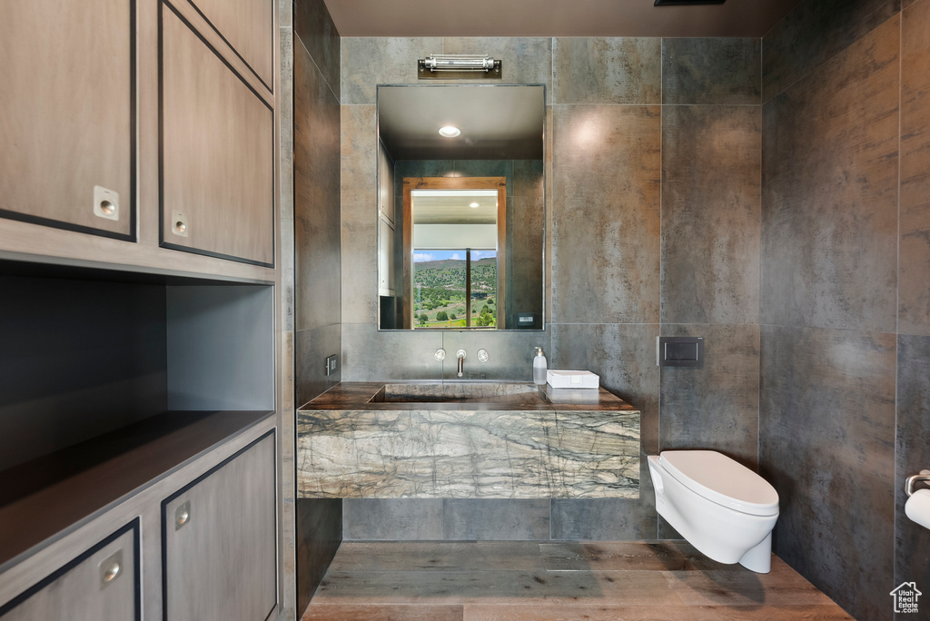 Bathroom featuring toilet and a bath