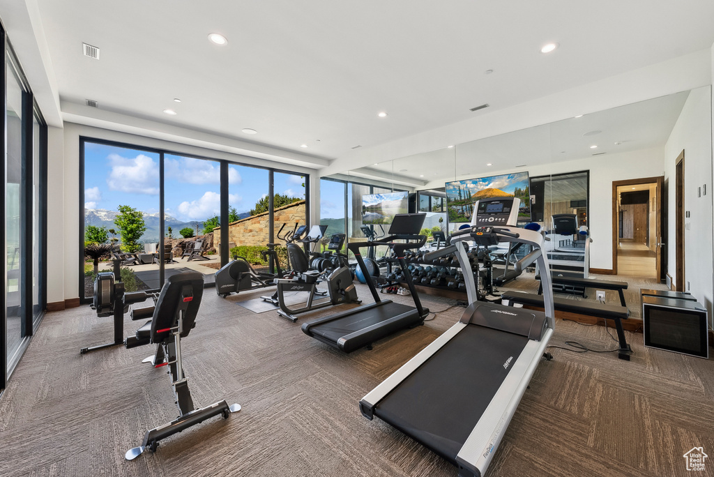 Gym with carpet and recessed lighting