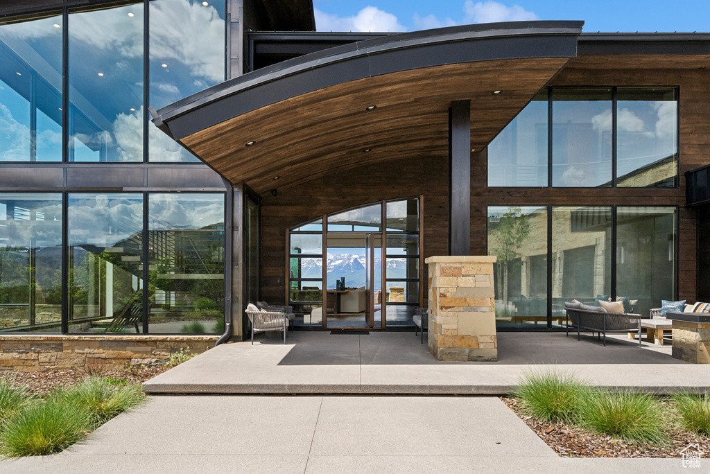 Property entrance featuring a patio area