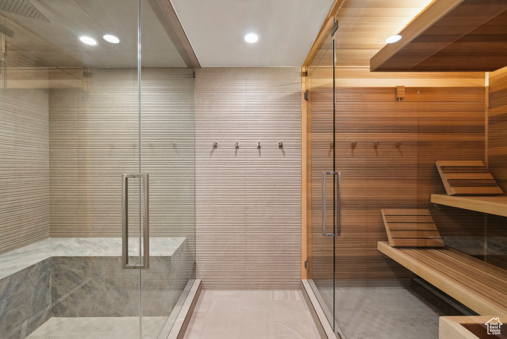 Full bathroom with a shower stall and recessed lighting
