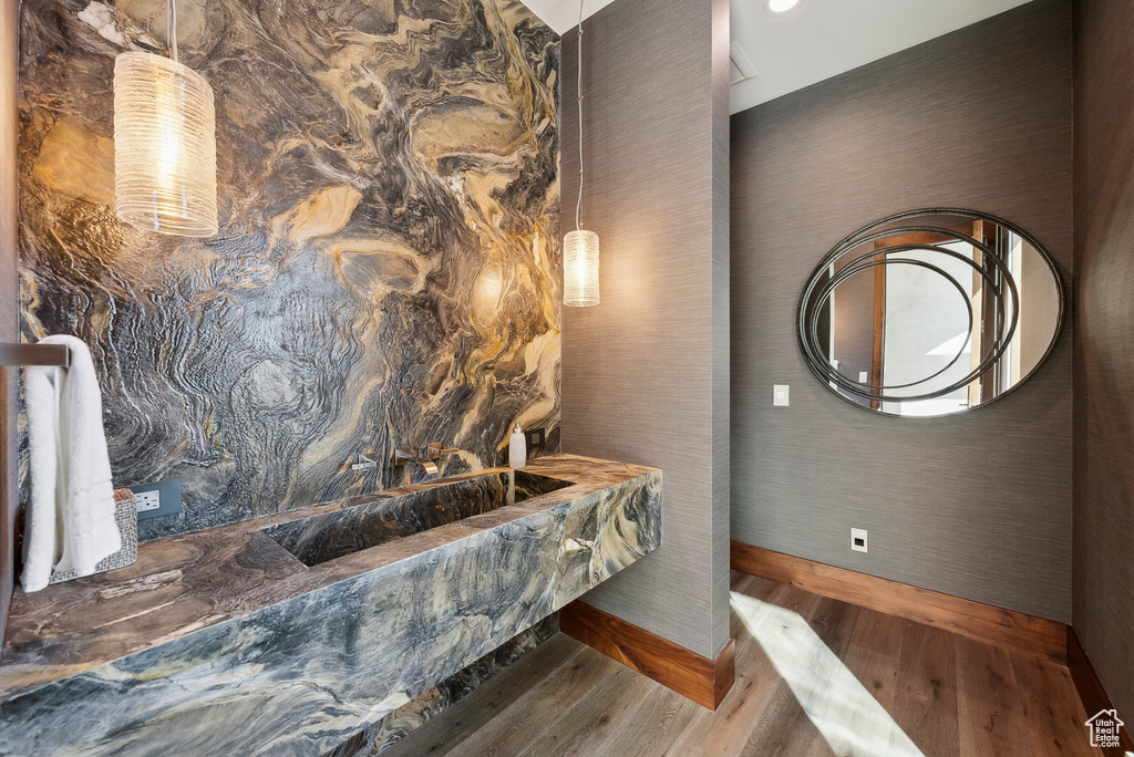 Bathroom featuring wood finished floors and baseboards