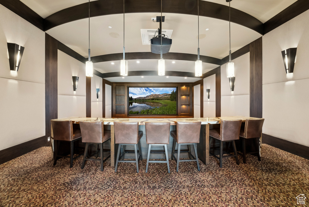 Home theater with a community bar and baseboards