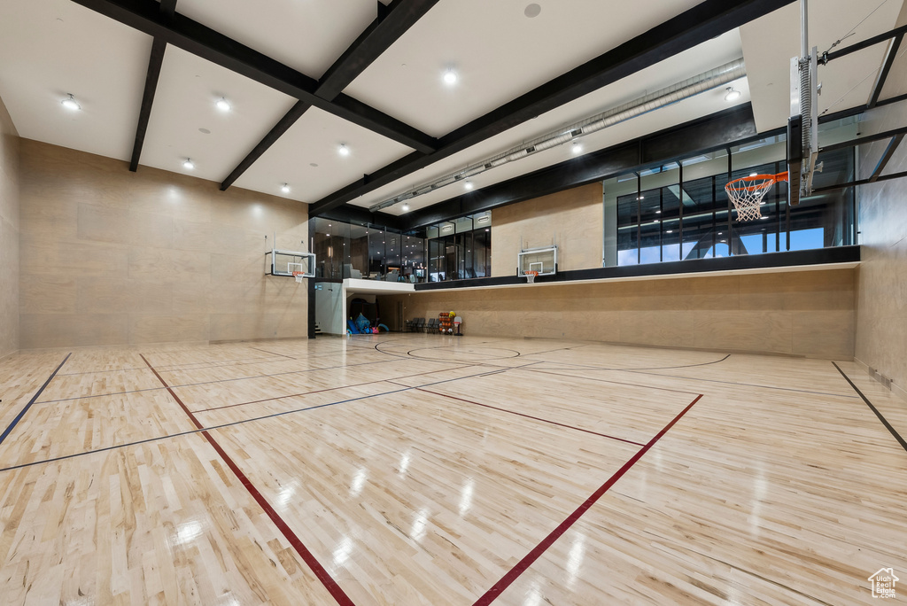 View of home\'s community with community basketball court and beam ceiling