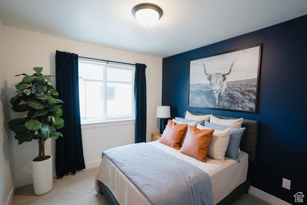 Carpeted bedroom with baseboards