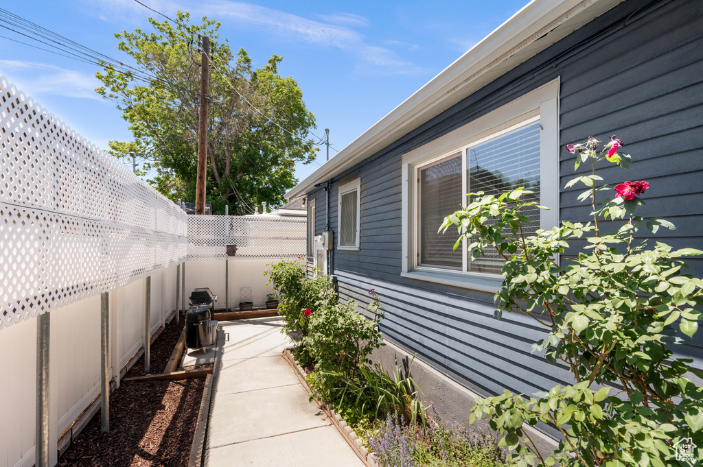 View of side of property featuring a fenced backyard