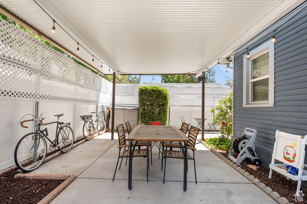 Fenced backyard featuring a patio and outdoor dining space