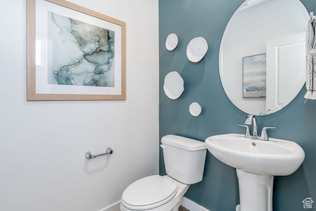 Bathroom with baseboards and toilet