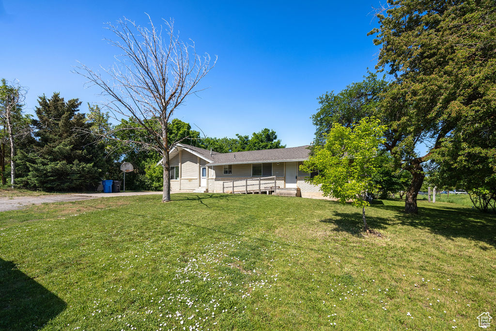 View of front of house featuring a front yard and a porch