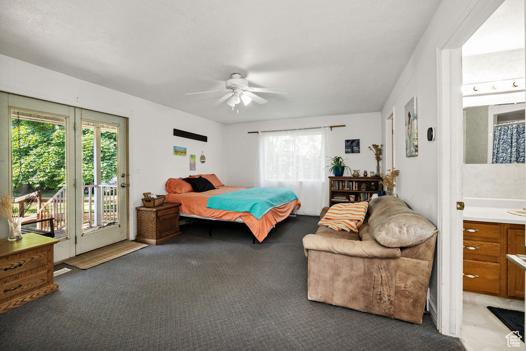 Bedroom with access to exterior, multiple windows, carpet, and ceiling fan